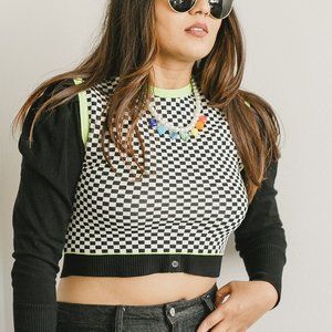 Checkerd black and white sleeveless crop top with neon green accents